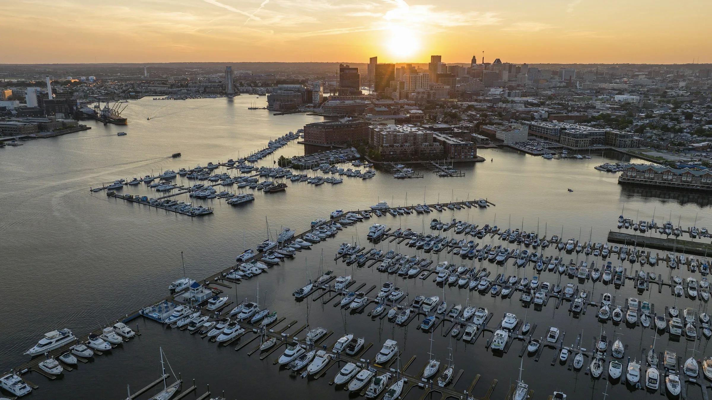 Baltimore’s harbor and skyline in warm evening light